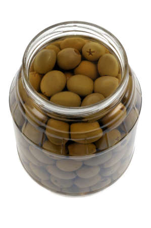 Jar of green olives open close-up on white backgroundの写真素材