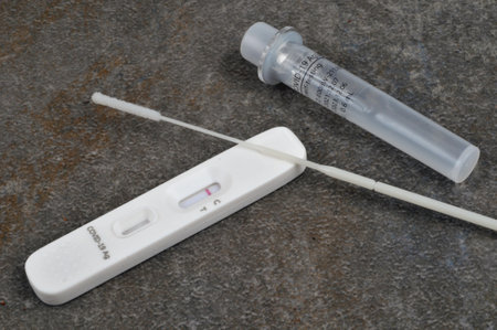 Covid-19 self-test kit on gray backgroundのeditorial素材