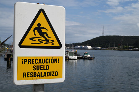 Road sign indicating Caution slippery floorの写真素材