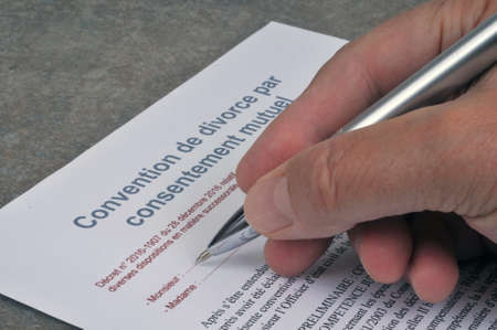Concept of signing a divorce agreement by mutual consent with a penの写真素材