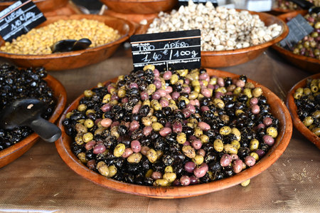 Salad bowl of a mix of olives on a market stallの写真素材