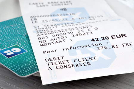 French cash receipt placed on a bank card close-upのeditorial素材