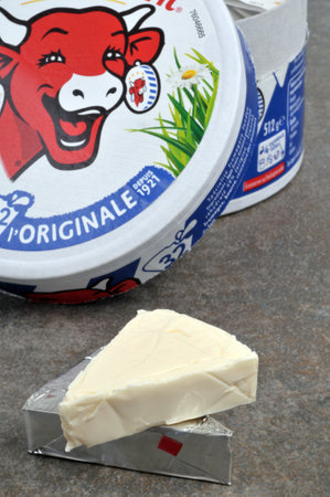 Box of The Laughing Cow opened with an open portion of cheeseのeditorial素材