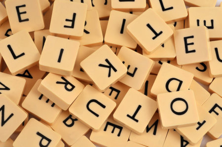 Letters of a Scrabble game shuffled close-upのeditorial素材