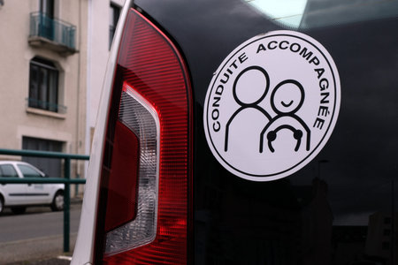 Accompanied driving sticker stuck on a car
