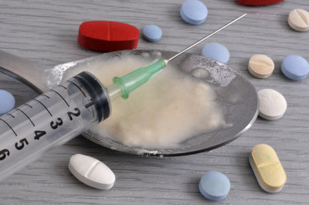 Addiction concept with various psychoactive substances and a syringeの写真素材