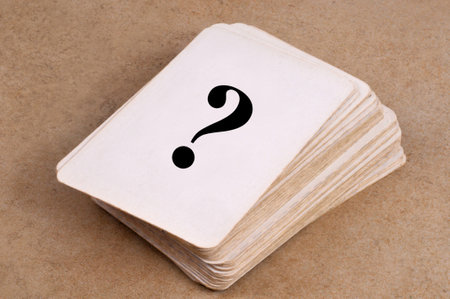 Question mark on a pile of cardsの写真素材