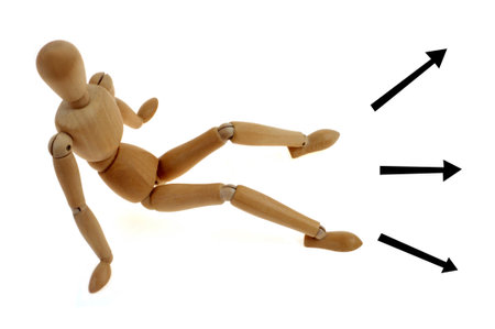 School counseling concept with a wooden jointed dummy and three arrowsの写真素材