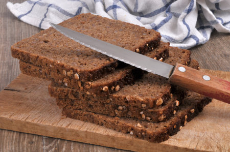 Nordic bread slices with a knife close-up