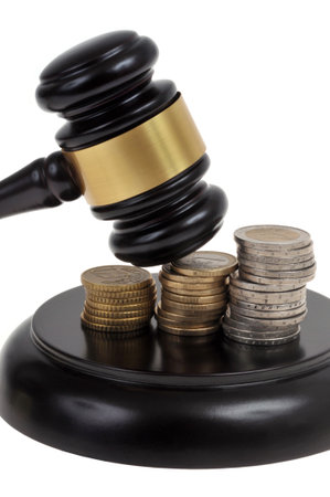 Judge gavel and stacks of euro coins close up on white backgroundの写真素材