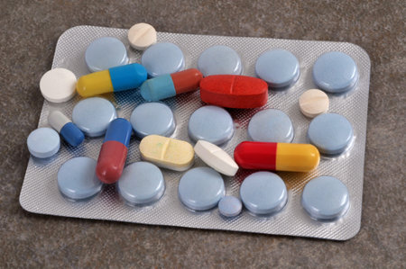 Assortment of medicines on a medicine blister close-up on a gray background