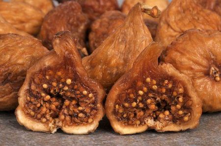 Dried fig cut in half with dried figs in the backgroundの写真素材