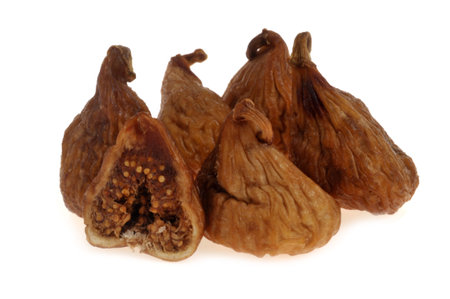 Dried figs with half a fig close-up on white backgroundの写真素材