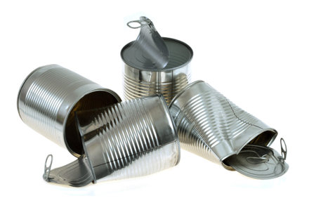 Recycling concept with empty tin cans close-up on white backgroundの写真素材