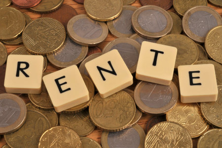 Annuity concept with alphabet letters laid on euro coinsの写真素材