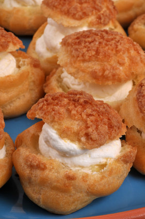 Homemade cream puffs closeup on backgroundの写真素材