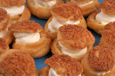 Homemade cream puffs closeup on backgroundの写真素材