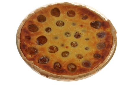 Homemade plum tart in a dish isolated on white backgroundの写真素材