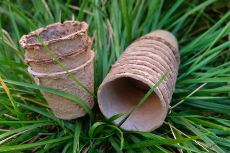 Biodegradable natural fiber pots closeup in the grassの写真素材