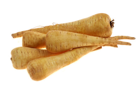 Close-up of raw parsnips isolated on a white backgroundの写真素材