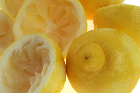 Close-up of squeezed lemon peels on background