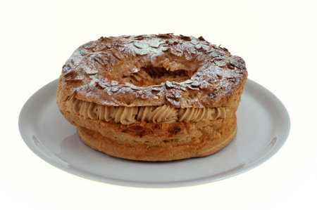Paris-Brest pastry in a dish closeup isolated on a white background