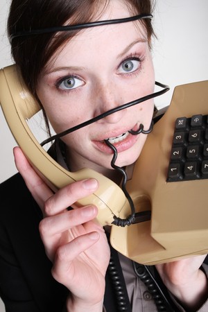 A woman has annoyance with her telephoneの写真素材