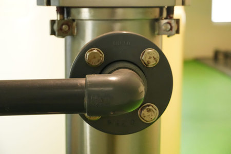 A flanged pipe connection with four visible bolts ensures a secure industrial joint. Mineral Water...