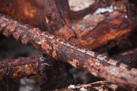 Close-up view of rusty chains heavily corroded over time