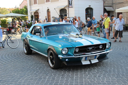 Senigallia, Italy, 8 August 2019 is an international music festival focused on the music and culture of the United States of the 1950s. Pictured: people dressed in 50s style and car paradeのeditorial素材