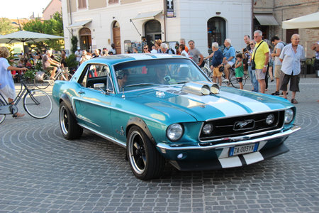 Senigallia, Italy, 8 August 2019 is an international music festival focused on the music and culture of the United States of the 1950s. Pictured: people dressed in 50s style and car paradeのeditorial素材