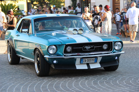 Senigallia, Italy, 8 August 2019 is an international music festival focused on the music and culture of the United States of the 1950s. Pictured: people dressed in 50s style and car paradeのeditorial素材