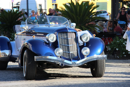Senigallia, Italy, 8 August 2019 is an international music festival focused on the music and culture of the United States of the 1950s. Pictured: people dressed in 50s style and car paradeのeditorial素材