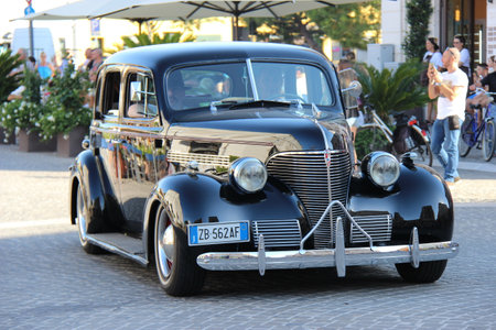 Senigallia, Italy, 8 August 2019 is an international music festival focused on the music and culture of the United States of the 1950s. Pictured: people dressed in 50s style and car paradeのeditorial素材