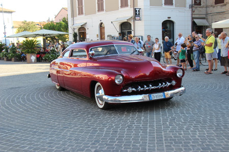 Senigallia, Italy, 8 August 2019 is an international music festival focused on the music and culture of the United States of the 1950s. Pictured: people dressed in 50s style and car paradeのeditorial素材