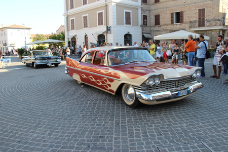 Senigallia, Italy, 8 August 2019 is an international music festival focused on the music and culture of the United States of the 1950s. Pictured: people dressed in 50s style and car paradeのeditorial素材