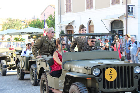 Senigallia, Italy, 6 August 2019 is an international music festival focused on the music and culture of the United States of the 1950s. Pictured: people dressed in 50s style and car paradeのeditorial素材