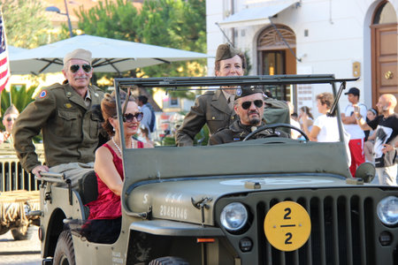 Senigallia, Italy, 6 August 2019 is an international music festival focused on the music and culture of the United States of the 1950s. Pictured: people dressed in 50s style and car paradeのeditorial素材