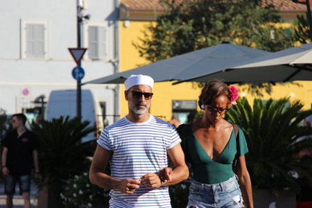 Senigallia, Italy, 6 August 2019 is an international music festival focused on the music and culture of the United States of the 1950s. Pictured: people dressed in 50s style and car paradeのeditorial素材