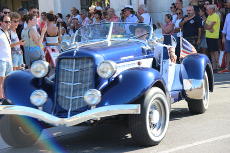 Senigallia, Italy, 6 August 2019 is an international music festival focused on the music and culture of the United States of the 1950s. Pictured: people dressed in 50s style and car paradeのeditorial素材