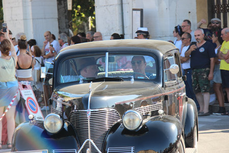 Senigallia, Italy, 6 August 2019 is an international music festival focused on the music and culture of the United States of the 1950s. Pictured: people dressed in 50s style and car paradeのeditorial素材