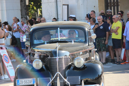 Senigallia, Italy, 6 August 2019 is an international music festival focused on the music and culture of the United States of the 1950s. Pictured: people dressed in 50s style and car paradeのeditorial素材