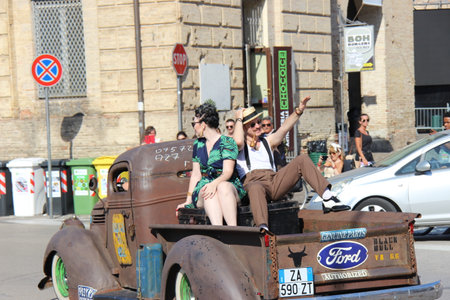 Senigallia, Italy 06 August 2019 is an international music festival focusing on American music and culture of the 1950s. In the photo: people dressed in the 50s and vintage carsのeditorial素材