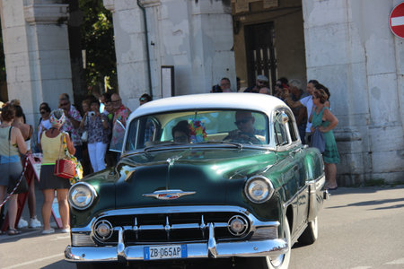 Senigallia, Italy 06 August 2019 is an international music festival focusing on American music and culture of the 1950s. In the photo: people dressed in the 50s and vintage carsのeditorial素材