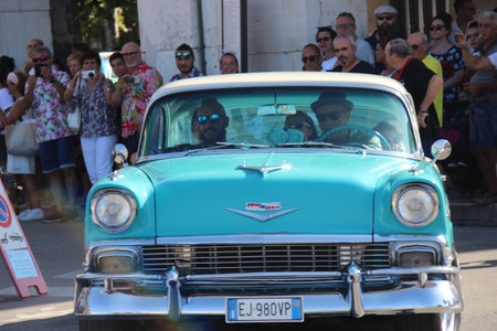 People vintage, Senigallia, Italy 12 August 2019 is an international music festival focused on American music and culture of the 1950s. In the photo: people dressed in vintage 1950s styleのeditorial素材