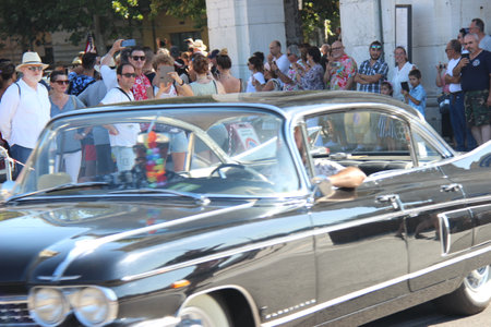 People vintage, Senigallia, Italy 12 August 2019 is an international music festival focused on American music and culture of the 1950s. In the photo: people dressed in vintage 1950s styleのeditorial素材