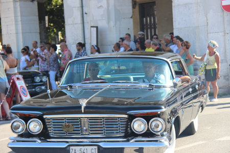 People vintage, Senigallia, Italy 12 August 2019 is an international music festival focused on American music and culture of the 1950s. In the photo: people dressed in vintage 1950s styleのeditorial素材