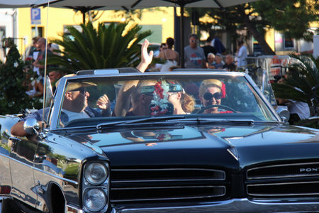 People vintage, Senigallia, Italy 6 August 2019 is an international music festival focused on the US music and culture of the fifties.In the photo: parade of vintage cars up in the 50s styleのeditorial素材