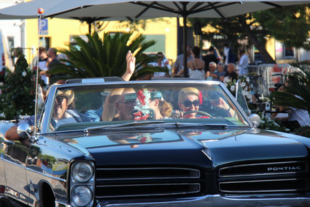 People vintage, Senigallia, Italy 6 August 2019 is an international music festival focused on the US music and culture of the fifties.In the photo: parade of vintage cars up in the 50s styleのeditorial素材