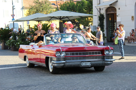 People vintage, Senigallia, Italy 6 August 2019 is an international music festival focused on the US music and culture of the fifties.In the photo: parade of vintage cars up in the 50s styleのeditorial素材